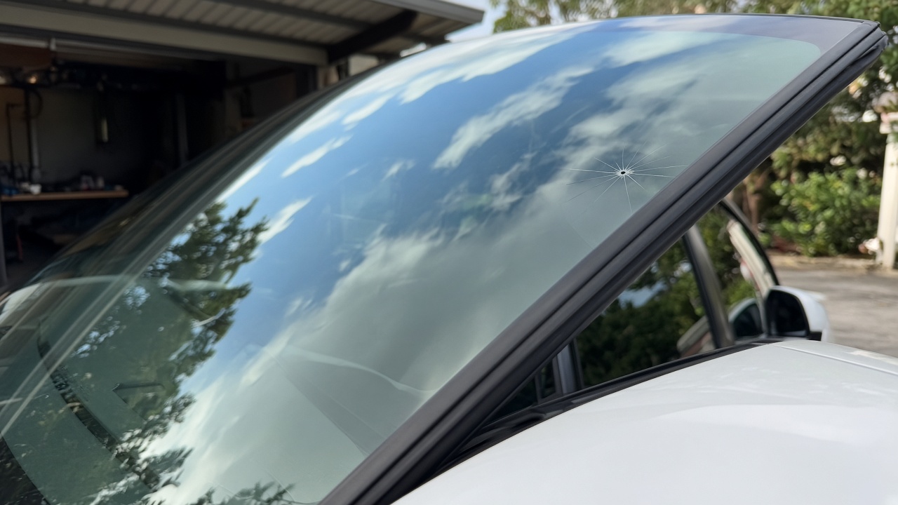 Small star chip in a white sedan windscreen