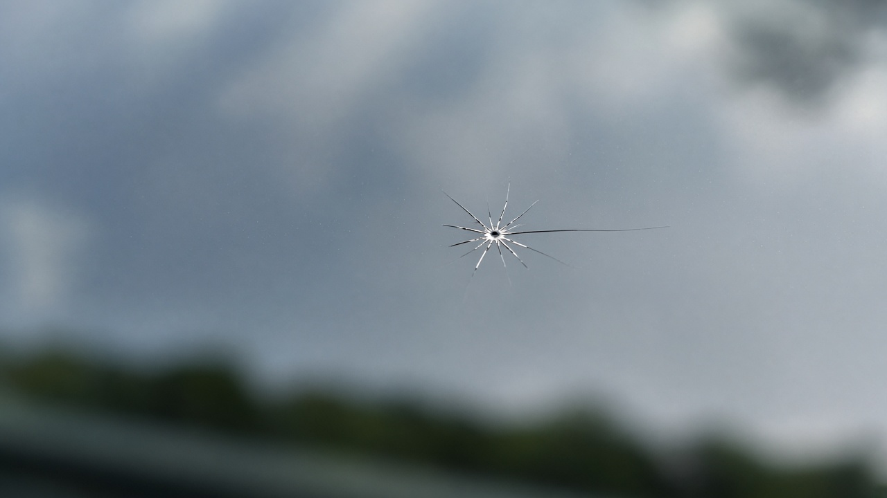 Close-up of a tiny star chip in a windscreen
