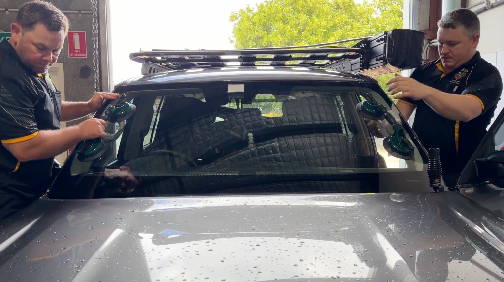 Local Guys technicians fitting a replacement windscreen