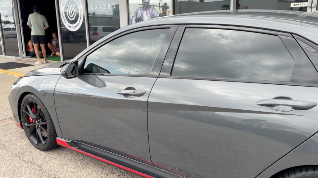 Grey sedan with professional window tinting