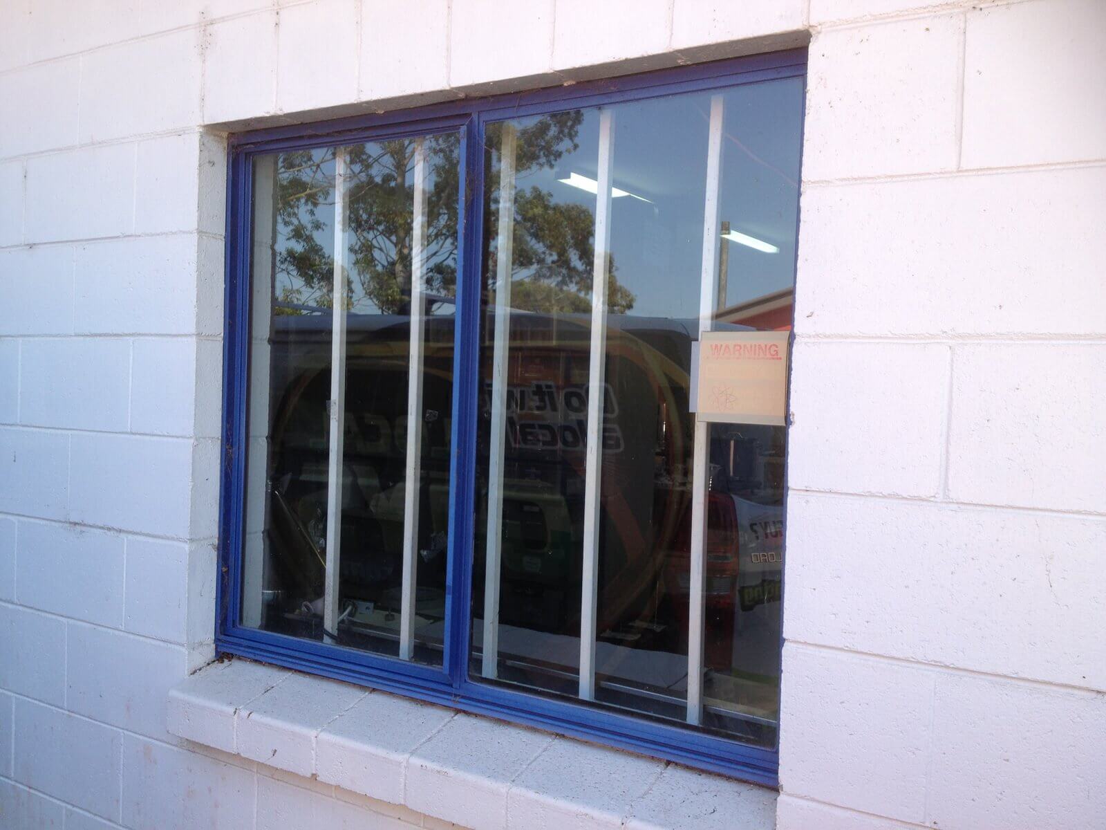 Before. Commercial solar window film by Local Guys