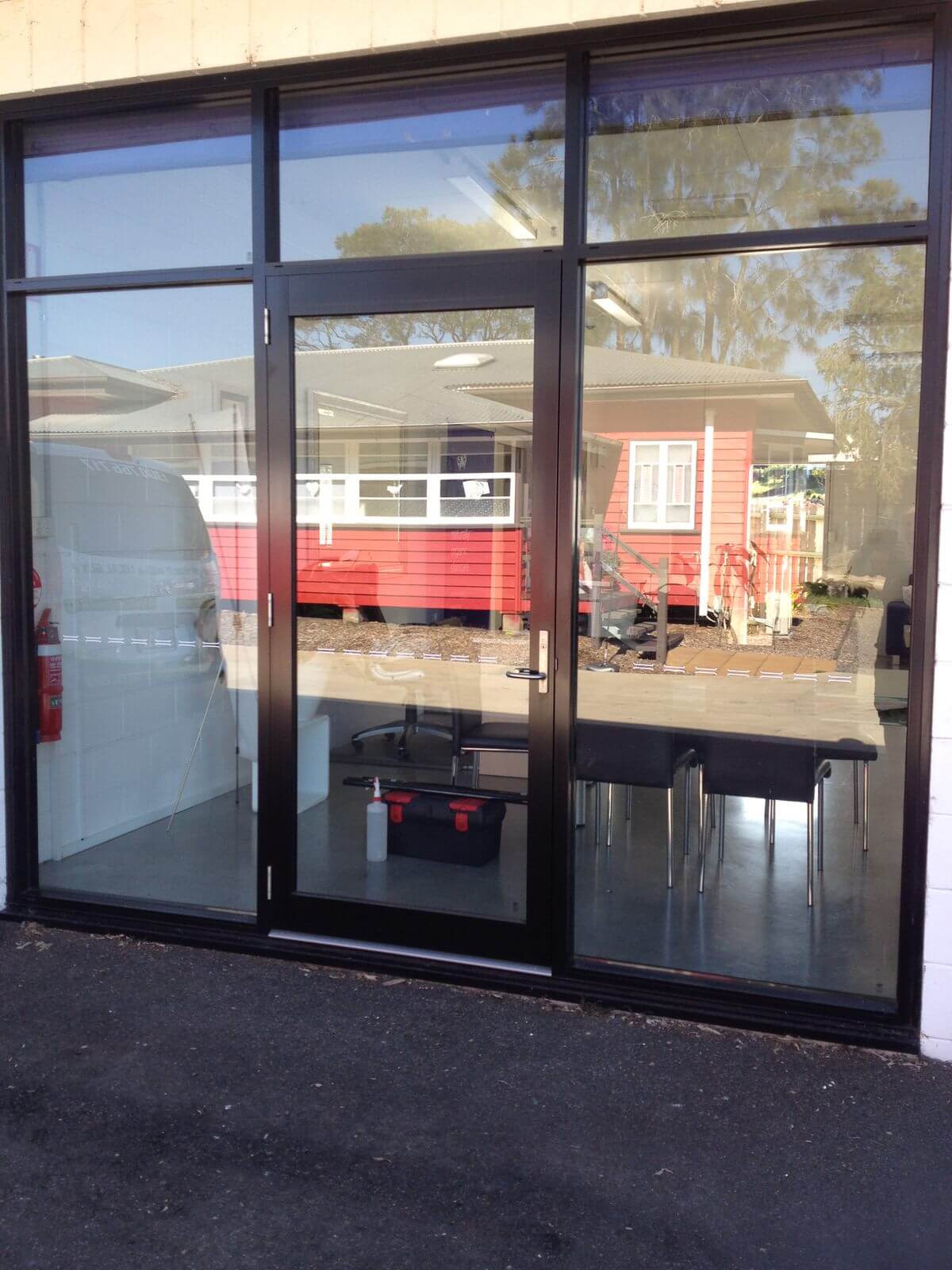 Before. Office shopfront window tinting by Local Guys