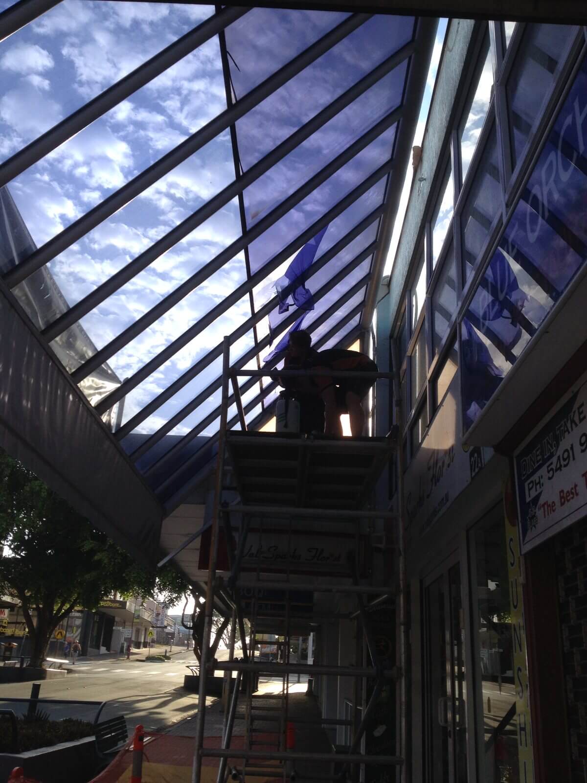 Before. Retail canopy solar film by Local Guys